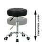 Black PU leather rolling stool chair by Global Star: Adjustable height and comfortable seating for office, salon, or spa.