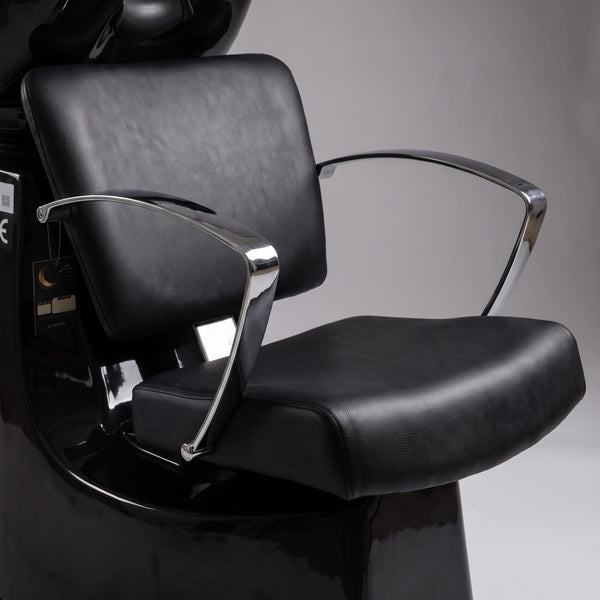 Close-up of Globalstar 4014 shampoo chair premium black PU leather seat and backrest with polished stainless steel chrome armrests
