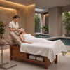 Globalstar 4783BI massage bed in use at luxury spa with therapist performing facial treatment, backrest raised