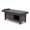 Globalstar XT-057 Professional Massage Bed with black leather upholstery, dark wood frame and built-in storage cabinet