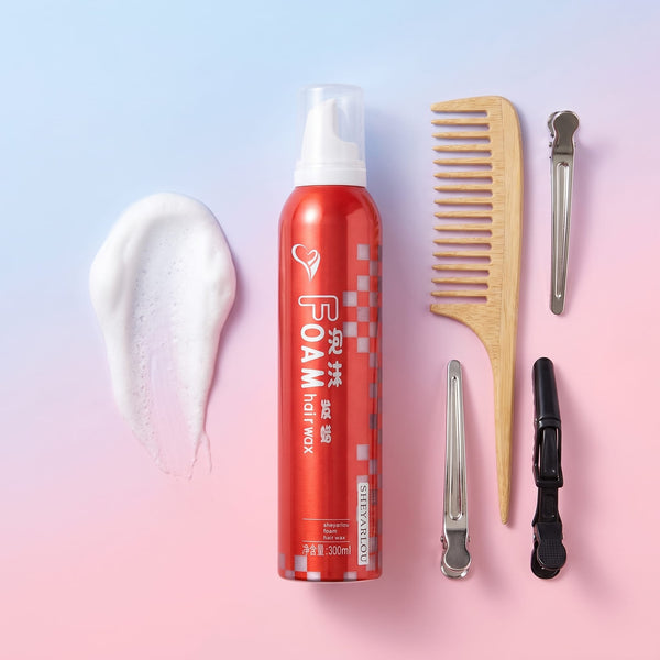 Hair care products including a can of foam, comb, and hair styling tools on a gradient background