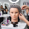 Stylist curling grey hair on Globalstar 613/1B mannequin training head with curling iron in luxury marble salon station with premium styling products