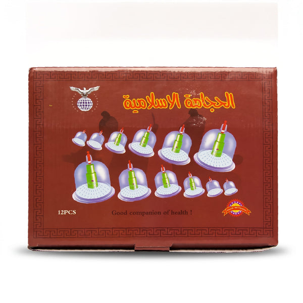 Black Professional Hijama Cupping Therapy Set 12 pieces box displayed in luxury spa setting with candles, hot stones, lavender and frankincense essential oils