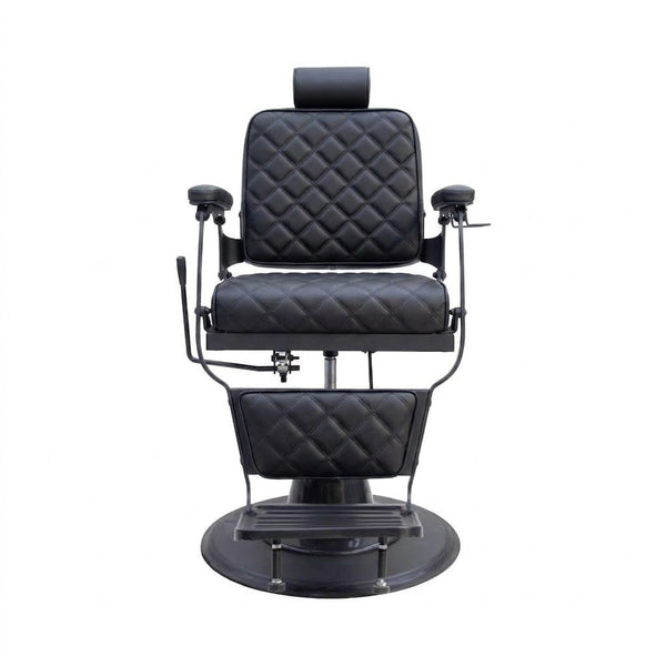 Black quilted barber chair on a white background