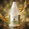 Spa therapist pouring Globalstar Natural Massage Oil After Wax 2-in-1 3.78L into glass bowl in luxury spa setting with lavender, palm leaves and hot stones