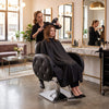 Globalstar BX-3010 premium ladies salon chair in luxury gold and dark wood salon interior with ornate mirror
