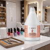 Female client removing red nail polish with Globalstar Pure Acetone 3.78L using cotton pad at luxury nail salon station with manicure tools and cuticle nippers