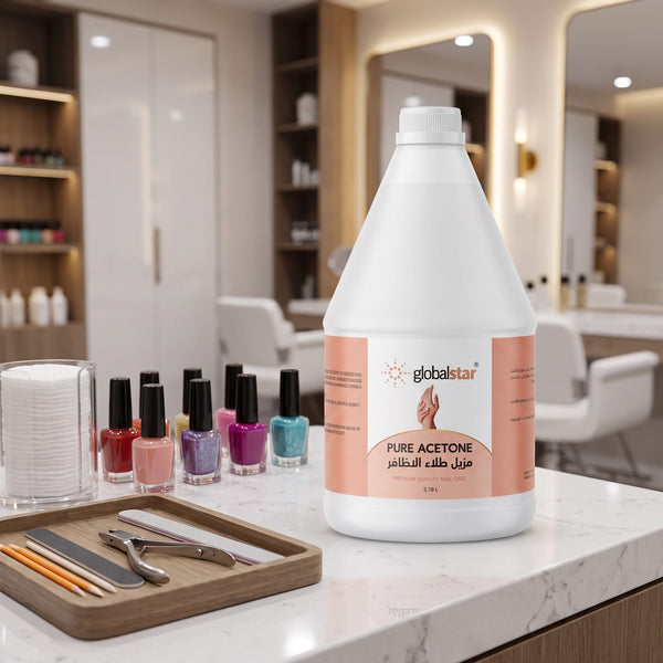 Female client removing red nail polish with Globalstar Pure Acetone 3.78L using cotton pad at luxury nail salon station with manicure tools and cuticle nippers