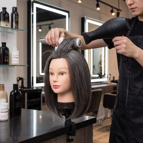 Hair colouring and foiling technique practice on Globalstar 613/4 mannequin training head in professional cosmetology classroom with colour theory chart