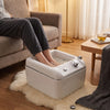 Person soaking feet in Globalstar T092 hydro-foot massage jacuzzi in cosy home living room setting