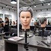 Globalstar 613/1B grey mannequin training head complete Salon Pro Training Equipment flat lay with scissors, combs, brushes, clips, styling products and clamp mount