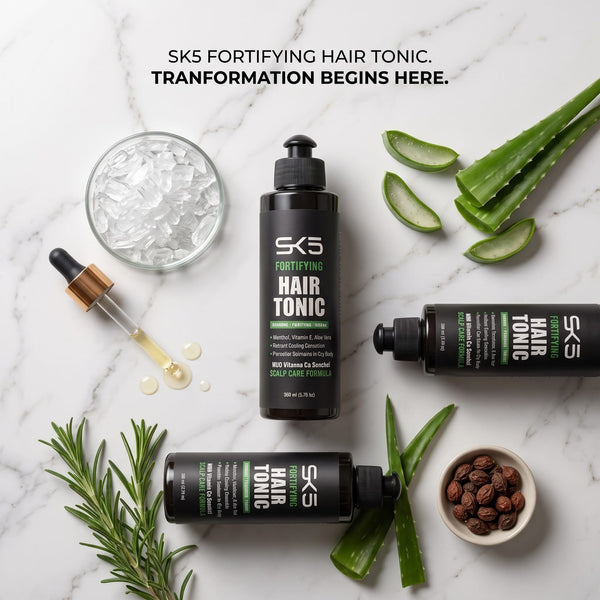 SK5 Fortifying Hair Tonic 200ml flat lay on marble with aloe vera, rosemary, and natural ingredients