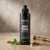 SK5 Fortifying Hair Tonic 200ml bottle on marble surface with fresh mint leaves and almonds